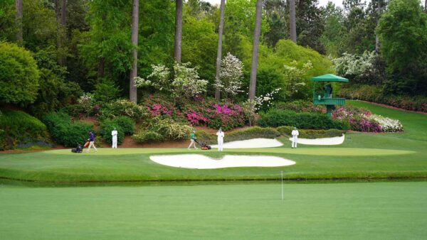 Augusta National grounds crew performing nightly turf restoration after the Masters tournament