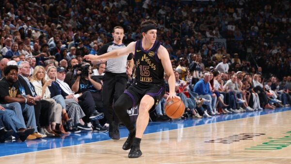 Dallas Mavericks and Los Angeles Lakers logos representing the MRI dispute between JJ Redick and Mavericks medical staff over Austin Reaves