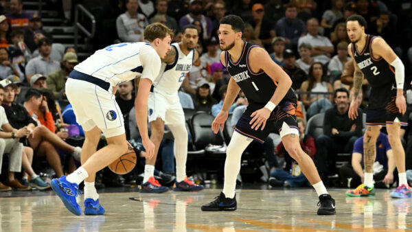 Mavericks vs Suns players in action during the final late-night NBA game of the season