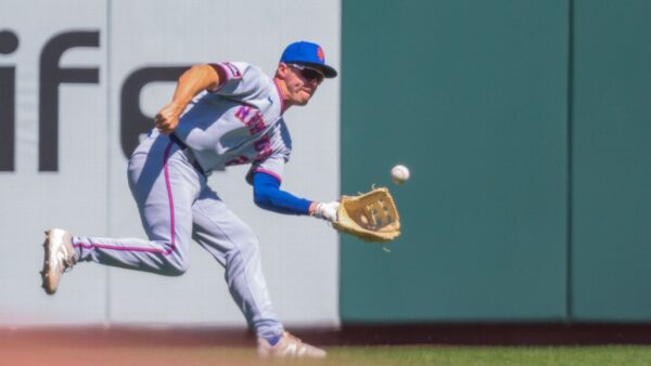 New York Mets player Jared Young injured on field with knee brace