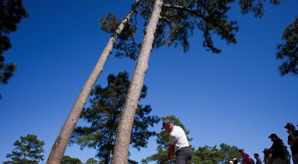 Mike Weir playing a shot during his challenging opening round at the Masters Tournament at Augusta National