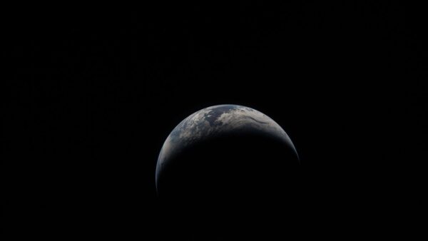 NASA Artemis II Earth image showing a crescent Earth from the Orion spacecraft window for Earth Day