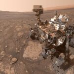 NASA Curiosity rover on Mars with drill site for organic molecule discovery