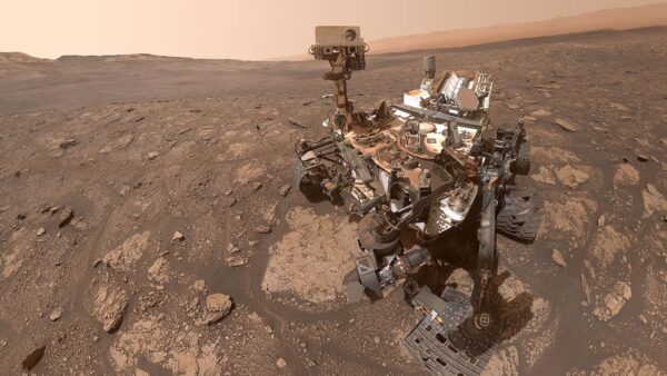 NASA Curiosity rover on Mars with drill site for organic molecule discovery