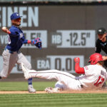 Washington Nationals and Los Angeles Dodgers players on the field during a weather delay at Nationals Park