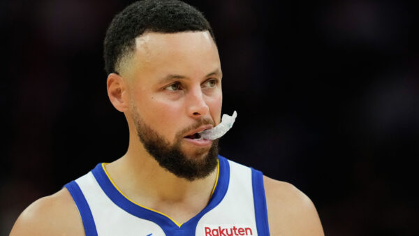 NBA officials review play during Warriors vs Rockets game with Steph Curry driving