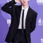 NCT member Mark Lee smiling in a photo, following news of his departure from SM Entertainment
