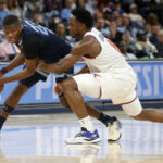 OG Anunoby guarding an opponent on the perimeter for the New York Knicks