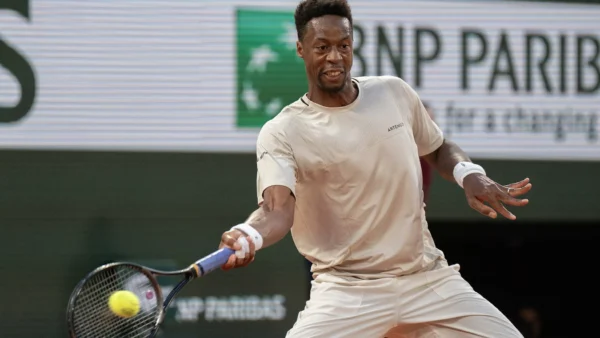 Reilly Opelka serving at the ATP Madrid Open clay court match against Nicolai Budkov Kjaer