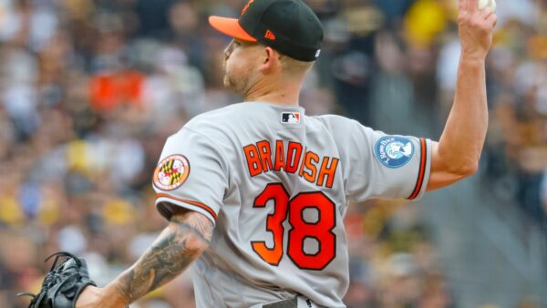 Baltimore Orioles pitcher Kyle Bradish warming up before a game seeking redemption against the White Sox
