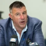 New England Patriots head coach Mike Vrabel discussing quarterback strategy at a press conference