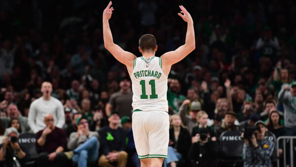 Boston Celtics guard Payton Pritchard shooting a clutch late shot clock three-pointer