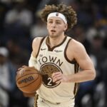 Golden State Warriors rookie Brandin Podziemski driving to the basket during a March NBA game