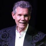 Randy Travis receives a standing ovation on stage during his More Life tour