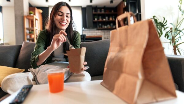 Restaurant customers enjoying Tax Day food deals and discounts at a table