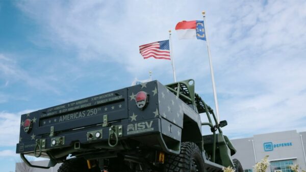 Rick Hendrick with the GM Defense ISV-U vehicle at the Barrett-Jackson auction benefiting the Medal of Honor Foundation