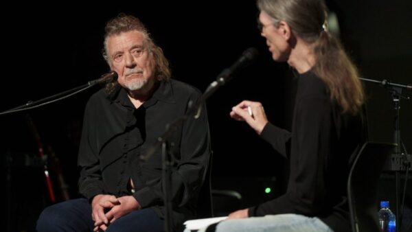 Robert Plant holding his Record Store Legend award at Spillers Records, the world's oldest record shop