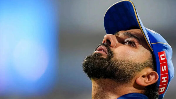 Rohit Sharma walks off the field with a hamstring injury during an IPL match