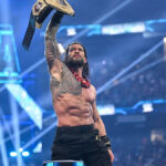 Roman Reigns holding the World Heavyweight Championship on WWE Raw after WrestleMania 42