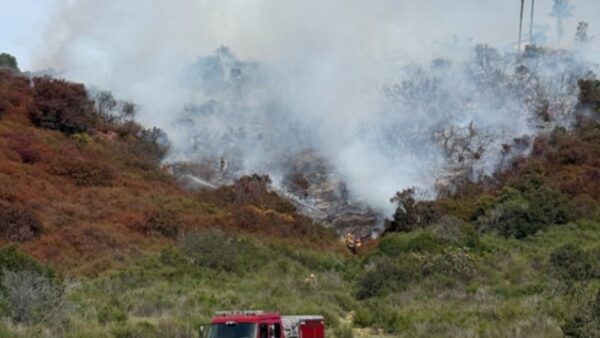 Aerial view of San Marcos vegetation fire near La Moree Road with emergency response vehicles