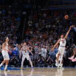 Shai Gilgeous-Alexander holding the NBA Clutch Player of the Year award