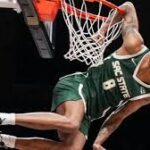 Shaqir O'Neal celebrates winning the College Slam Dunk Championship at Hinkle Fieldhouse