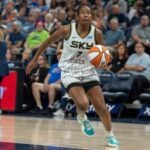 Ariel Atkins and Rickea Jackson in WNBA jerseys during a potential trade between the Los Angeles Sparks and Chicago Sky