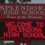 Splendora High School exterior building during secure hold protocol after reported student-staff altercation