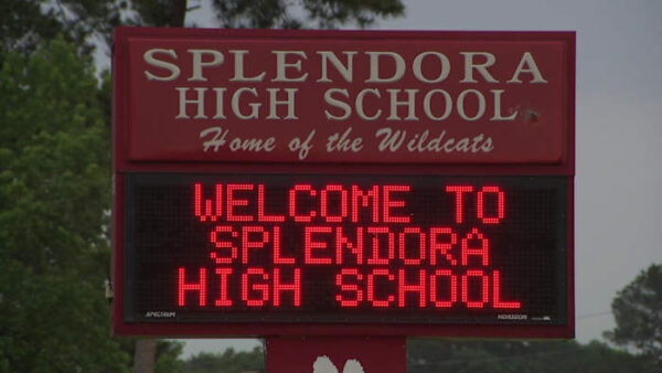 Splendora High School exterior building during secure hold protocol after reported student-staff altercation