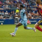 Sporting Kansas City players face off against Real Salt Lake in an MLS match, highlighting the injury-depleted RSL squad.