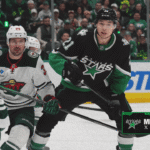 Dallas Stars players on bench discussing strategy after Game 1 playoff loss to Minnesota Wild