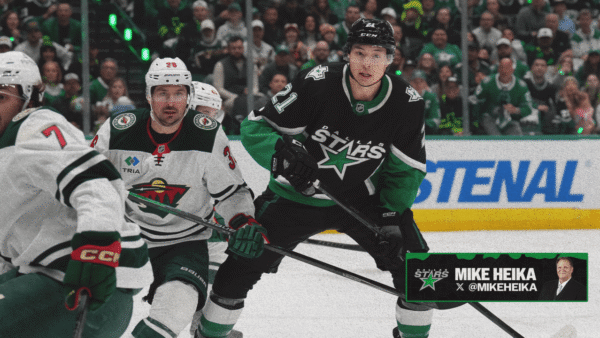 Dallas Stars players on bench discussing strategy after Game 1 playoff loss to Minnesota Wild