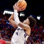 Texas A&M guard PJ Haggerty driving to the basket in an Aggies uniform