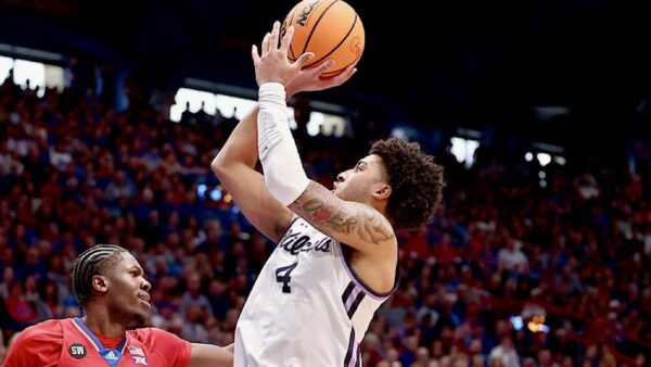Texas A&M guard PJ Haggerty driving to the basket in an Aggies uniform