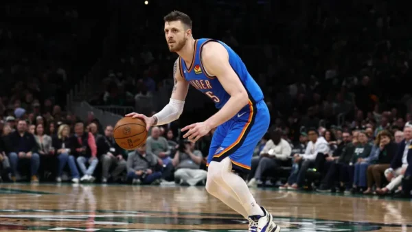 Oklahoma City Thunder players Luguentz Dort and Isaiah Hartenstein on court during a game
