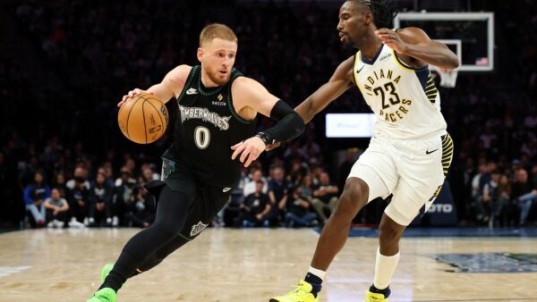 Minnesota Timberwolves player driving to the basket against the Indiana Pacers at Gainbridge Fieldhouse