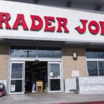 Trader Joe's storefront and $7.4 million settlement eligibility information graphic