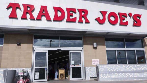 Trader Joe's storefront and $7.4 million settlement eligibility information graphic