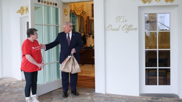 President Donald Trump tipping a DoorDash driver $100 outside the Oval Office in a staged tax policy event