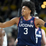 UConn forward Jaylin Stewart driving to the basket in a game