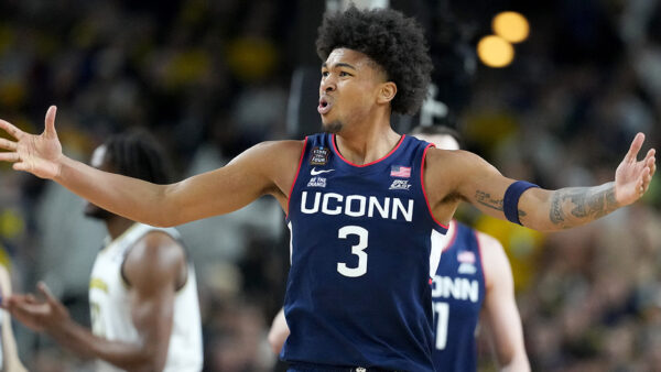UConn forward Jaylin Stewart driving to the basket in a game