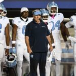 UNC football head coach Bill Belichick overseeing team nutrition program in the lunchroom