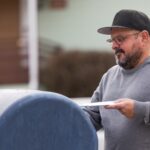 USPS mailbox with tax return envelope showing risk of late filing due to postmark delays
