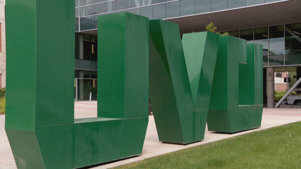 UVU campus building with text overlay about Sharon McMahon commencement speaker cancellation