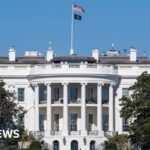 White House building exterior with warning about prediction market betting