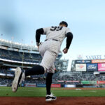 New York Yankees players look on during a game against the Oakland Athletics, with pitcher Jeffrey Springs preparing to throw