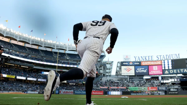 New York Yankees players look on during a game against the Oakland Athletics, with pitcher Jeffrey Springs preparing to throw
