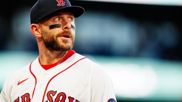 New York Yankees and Boston Red Sox players face off at Fenway Park during an MLB game